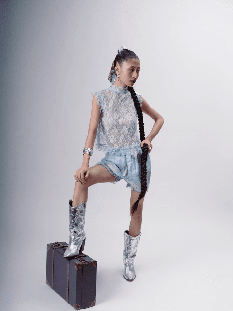 Image may contain Child Person Clothing Footwear Shoe Bag Shorts Accessories Handbag and Dress