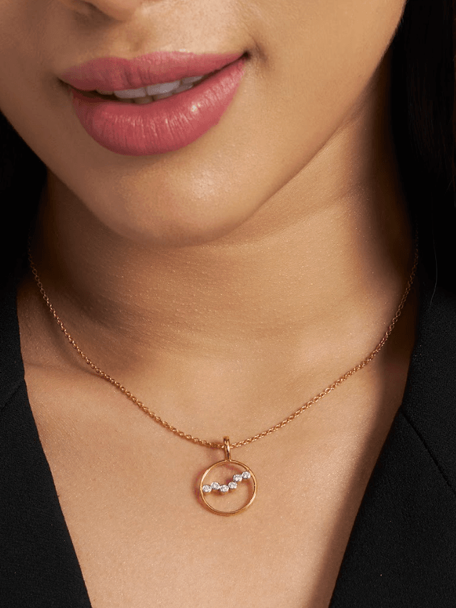 Image may contain Accessories Pendant Jewelry Necklace Cosmetics Lipstick and Locket